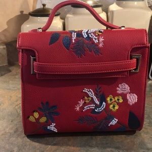 Super cute red faux leather purse with embroidery